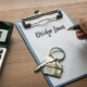 bridge loan written on clip board with house keys