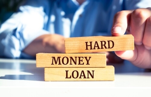 three blocks with hard money loans written on them vertically